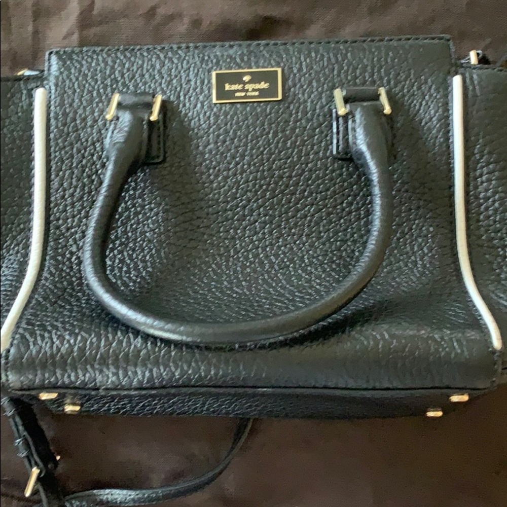 Black Kate Spade purse with white piping